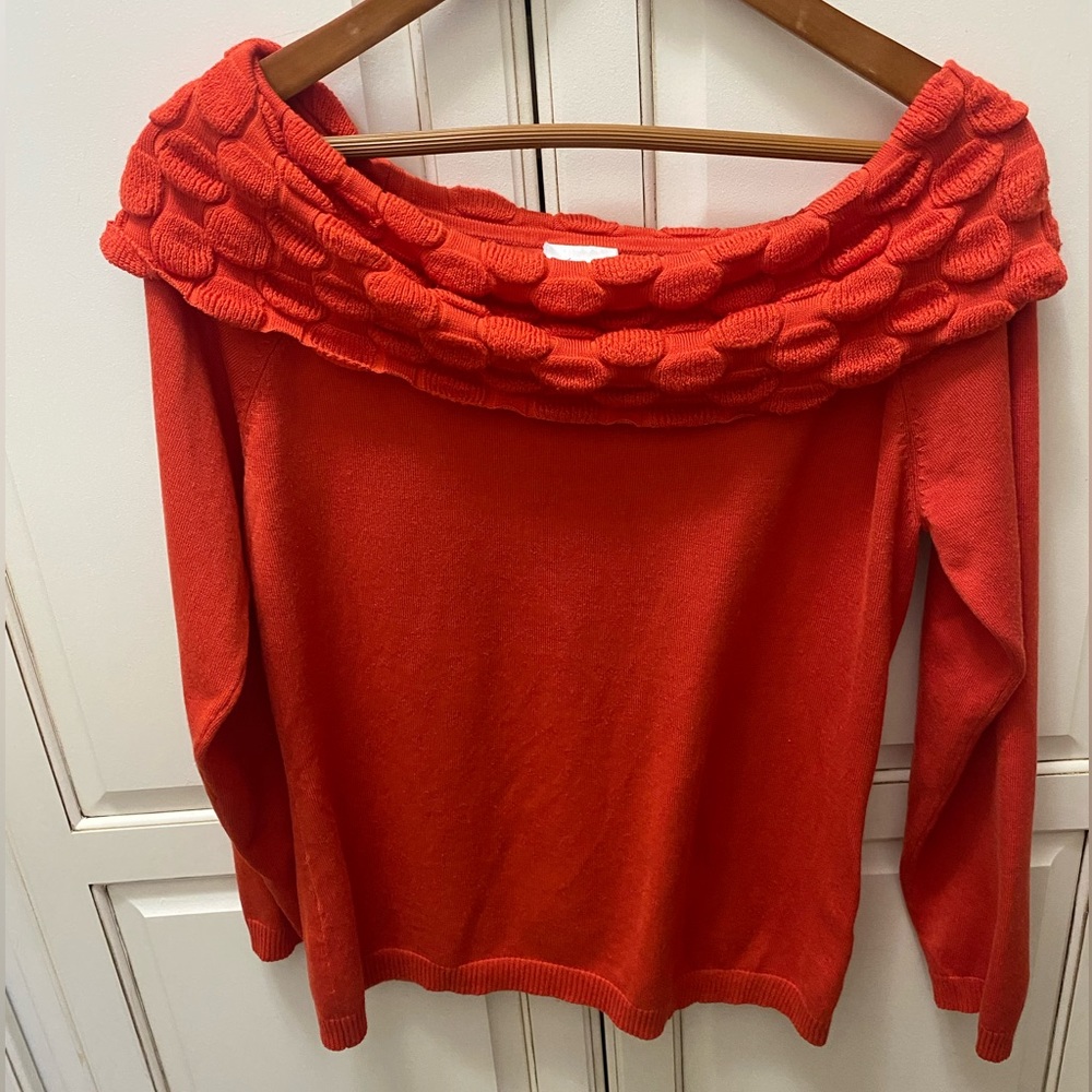 Kim Roger’s orange knit sweater boat neck shawl collar